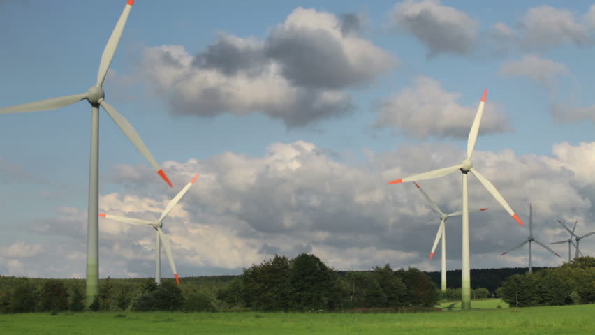 Wind power plants on blue sky background 