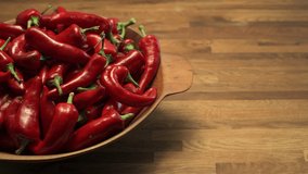 A bowl of ripe red New Mexico Chile ready to become part of a spicy and delicious southwest dish. Pan motion video in 4K.