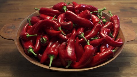 A bowl of ripe red New Mexico Chile ready to become part of a spicy and delicious southwest dish. Pan motion video in 4K.