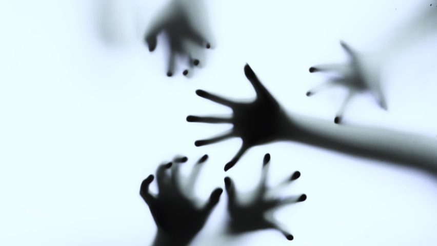 Silhouette of a zombie hand on white background in slow motion
 | Shutterstock HD Video #1080257690