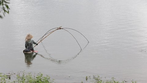 Thai fishermen using fishing tools in the dam Or call this tool also known Sadung