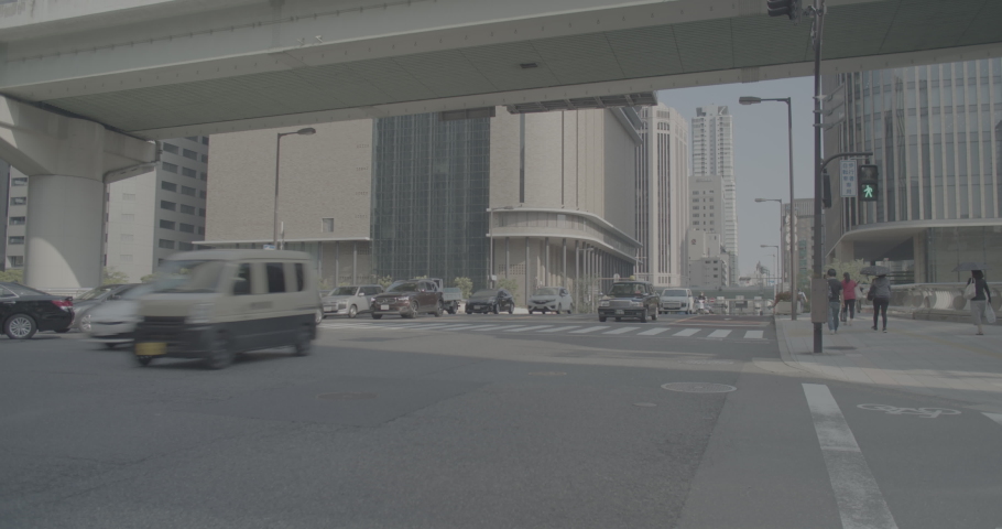 Cars Driving on a Wide Street in Osaka