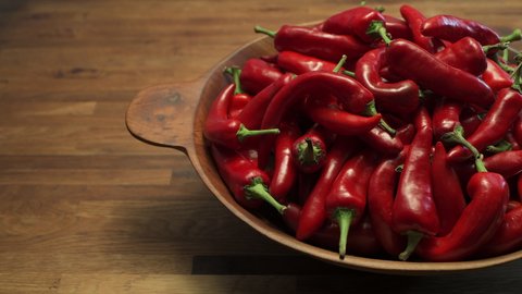 A bowl of ripe red New Mexico Chile ready to become part of a spicy and delicious southwest dish. Pan motion in 4K.