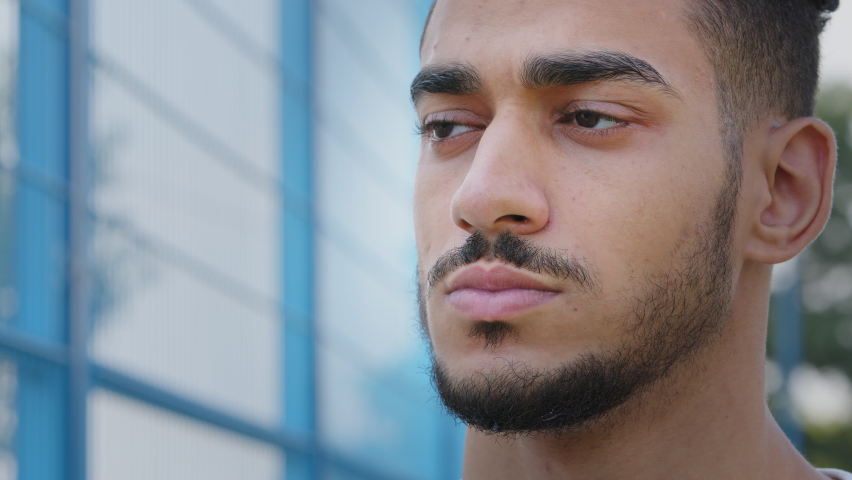 Closeup portrait of tired upset sad young Middle Eastern Arab man rubbing bridge of nose. Millennial Indian guy student touches face, wants to sleep, feels tension, headache, eye fatigue, needs rest Royalty-Free Stock Footage #1080279692
