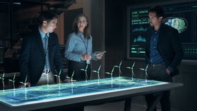 Professional Engineers and Specialists Working on Renewable Clean Energy Innovative Project Analyzing the Efficiency of Wind Turbines using Futuristic Holographic AR Technology. Cinematic 4K. - Powered by Shutterstock - Get 15% off with code: PIKWIZARD15