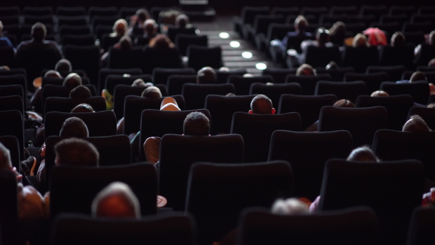 Audience in a movie theater watching a film - big cinema | Shutterstock HD Video #1080299651
