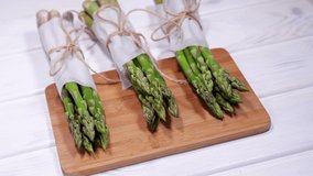 Asparagus, Fresh raw organic green Asparagus sprouts closeup, Healthy vegetarian food. Raw vegetables, market. Vegan backdrop. Slow motion 4K UHD video