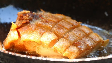 Frying  pork skin in pan, in door  Chiangmai Thailand