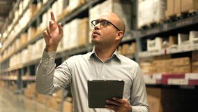 Supply chain. Young manager worker checklist manage parcel box product in warehouse. Asian supervisor man using tablet working at store industry. Logistic import export Distribution warehouse. - Powered by Shutterstock - Get 15% off with code: PIKWIZARD15