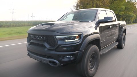 Minsk, Belarus - September 10, 2021: Dodge Ram TRX drives on a country road. Ram TRX is the most powerful series-production pick-up. Its 6,2-liter Supercharged V8 delivers 702 hp.