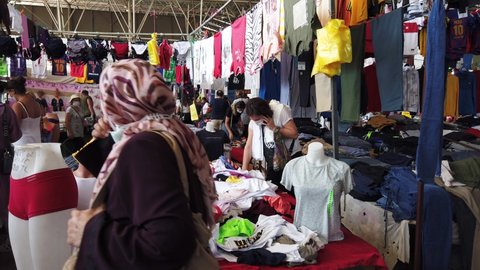 Turkey, Antalya, 22 August-2021. A lot of people, buyers came to the weekly market in Antalya. Market on Wednesdays, large bazaar selling clothes and home textiles.