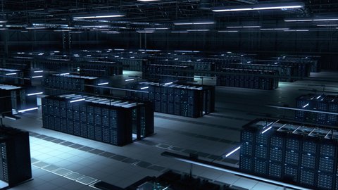 Modern Data Technology Center Server Racks Working in Dark Room. Concept of Internet of Things, Big Data Protection, Storage, Cryptocurrency Farm, Cloud Computing. 3D Moving Back Panning Camera Shot.