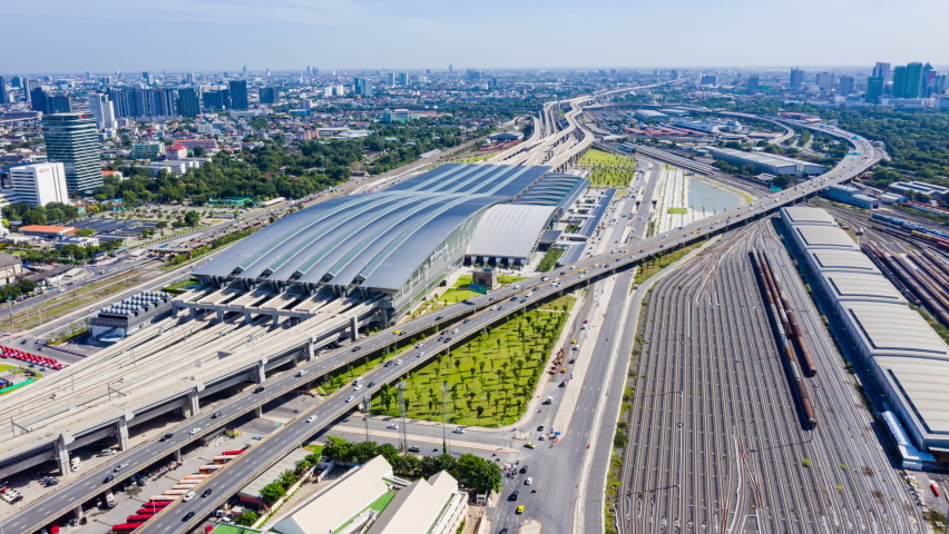 Time-lapse train station top view. Passenger and freight trains at Bang Sue Grand Station in Bangkok, Thailand on Bang Sue railway station is one of largest transport hubs. 4K Royalty-Free Stock Footage #1080326957