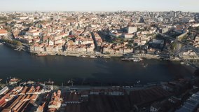 Porto. Portugal. Drone footage of the historic centre and the River Douro on the Gaia side. Oporto urban train on the journey along Dom Luis I Bridge. High quality 4k footage