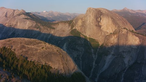 Yosemite, California circa-2021: Aerial view of Half Dome in Yosemite National Park. Shot with Cineflex from Helicopter with RED 8K.