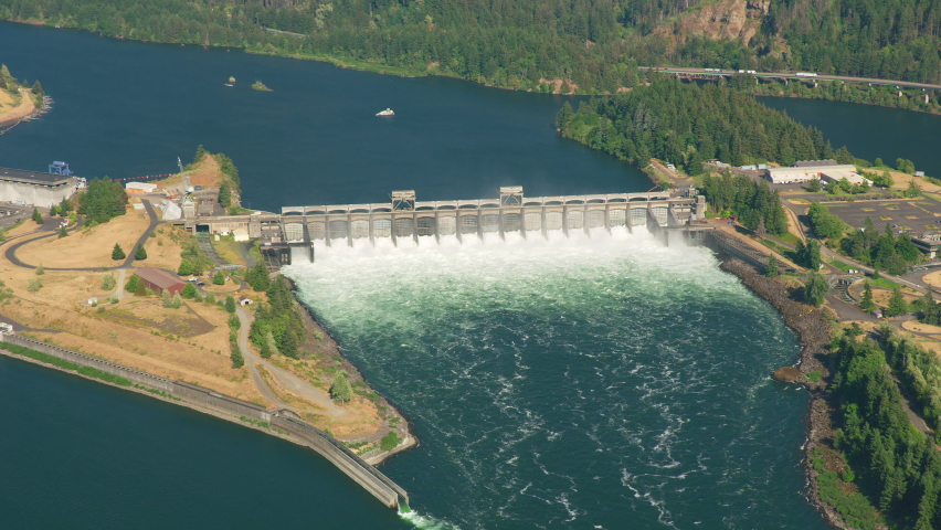 Oregon circa-2021: Aerial view of Bonneville Dam on the Columbia River Gorge. Shot with Cineflex from Helicopter with RED 8K. Royalty-Free Stock Footage #1080336068