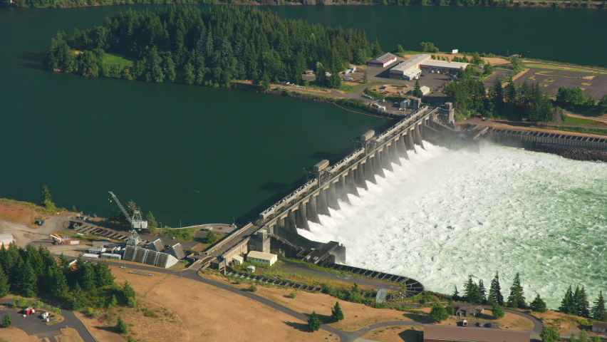 Oregon circa-2021: Aerial view of Bonneville Dam on the Columbia River Gorge. Shot with Cineflex from Helicopter with RED 8K. Royalty-Free Stock Footage #1080336068