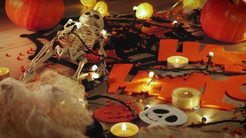 Happy halloween concept. Scary pumpkin faces and decoration on halloween party. Trick or treat. Halloween pumpkins, spiders, bats and cobwebs in candles lights. Halloween night