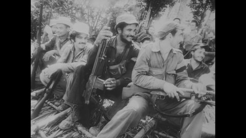 CIRCA 1958 - Fidel Castro's guerrilla forces grow in number and engage in combat.
