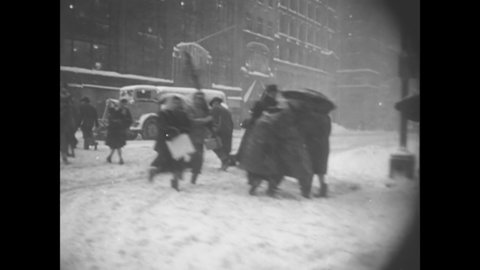 CIRCA 1956 - People shovel out their cars and try to drive on icy roads during a snowstorm in New York City.