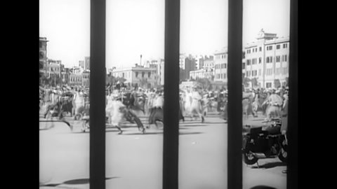 CIRCA 1938 - A riot erupts outside Abdeen Palace between Blue Shirts and Wafd party members in Cairo, Egypt.