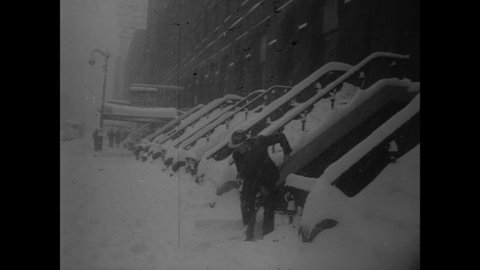 CIRCA 1953 - A snowstorm is welcomed as respite from record-breaking hot weather in the USA.