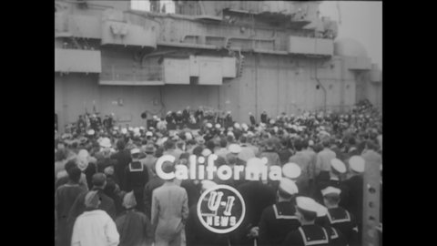 CIRCA 1952 - Local Boy Scout troops take part in the re-commissioning ceremony of the USS Intrepid in San Francisco, California.