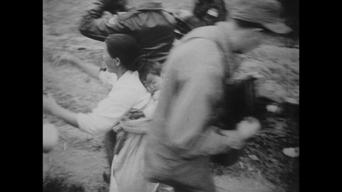 CIRCA 1951 - North Korean soldiers return a boy to UN officers and his family in South Korea after he had gone missing for 19 days.