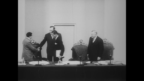 CIRCA 1951 - Secretary Acheson speaks with Prime Minister Eden at a UN General Assembly, where Andrey Vyshinsky keeps distant.