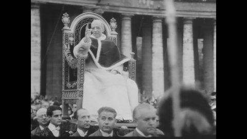 CIRCA 1948 - Young men of the Catholic Action organization cheer and wave to the Pope as he passes by.