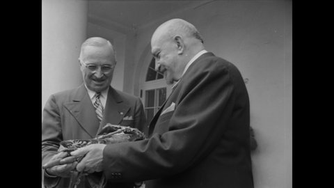 CIRCA 1948 - Israeli President Chaim Weizmann presents a Torah to President Truman.