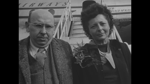CIRCA 1948 - Composer Hanns Eisler and his wife leave New York by plane, leaving voluntarily ahead of deportation proceedings linked to communism.