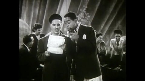 CIRCA 1946 - In this race musical, Dizzy Gillespie meets a comedic piano playing duo who then begin a song.