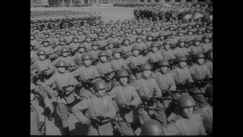 CIRCA 1945 - Japanese officers watch the Russian military's May Day parade through Red Square in awe, and American units also participate.