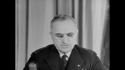 CIRCA 1945 - President Truman reads a declaration about Nazi Germany's surrender to the United Nations.