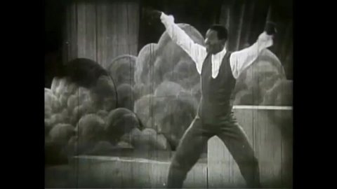 CIRCA 1946 - In this race musical, a man concludes a dance on stage to xylophone jazz.