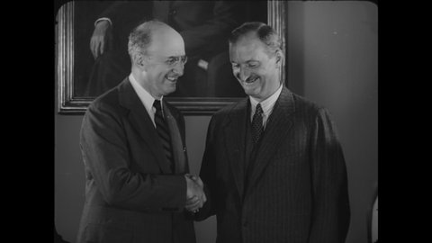 CIRCA 1939 - Secretary Morgenthau oversees an assistant being sworn in to the Treasury Department.