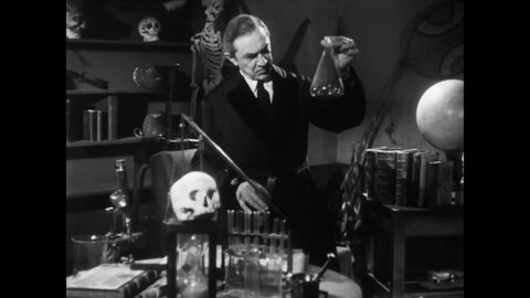 CIRCA 1953 - In this horror film, a mad scientist (Bela Lugosi) finishes making a potion that will help him create life.
