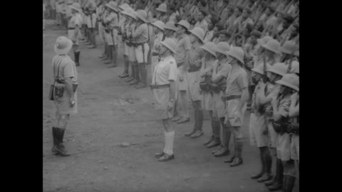 CIRCA 1940s - French military officers inspect troops stationed in Africa.