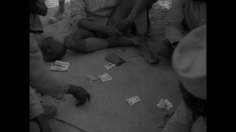 CIRCA 1940s - Men of the Senegalese Tirailleurs play a game of cards in their downtime.