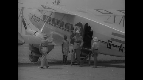 CIRCA 1940s - General de Gaulle arrives by plane in North Africa.
