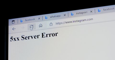 Paris, France - Oct 4, 2021: Mouse pointer pressing refresh Instagram webpage with 5xx Server Error message as engineers are trying to debug services as global outages of its social network platforms