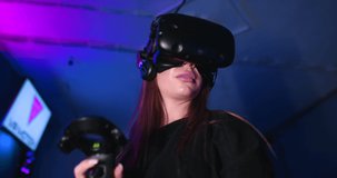 Young woman playing virtual reality games. There is an effect of noise, grain.