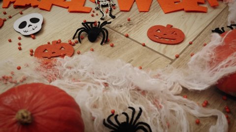 Halloween decoration with bats pumpkins spiders web and skeleton. Scary Halloween pumpkins