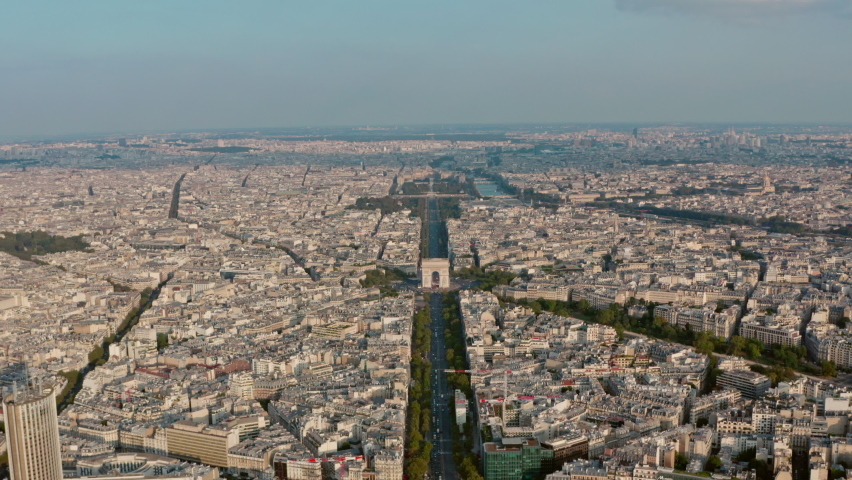 Dolly forward drone shot of the Arc de Triomphe Champs Elysees Paris golden hour sunset Royalty-Free Stock Footage #1080369014