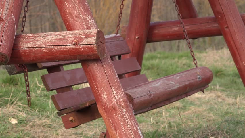 4K Closeup of rustic swing with empty chair in summer holiday in nature by day Royalty-Free Stock Footage #10803746