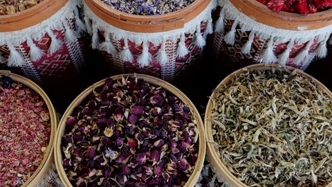 tilt up shot of varieties of turkish herbal tea and delights baklava and lokum on display in turkish store