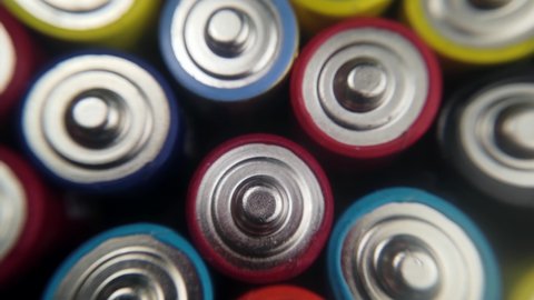 Various Close up background of various alkaline batteries. top view