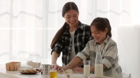 Chinese Mom And Daughter Baking Cake And Having Fun With Flour Touching Each Other's Noses Standing In Modern Kitchen At Home. Asian Family Of Two Bonding Cooking Together On Weekend - Powered by Shutterstock - Get 15% off with code: PIKWIZARD15