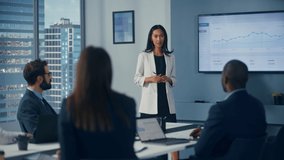 Office Conference Room Meeting: Portrait of Confident Asian Female Top Manager Presents e-Commerce Investment Strategy for Group of Digital Entrepreneurs. Wall TV with Big Data Analysis, Infographics - Powered by Shutterstock - Get 15% off with code: PIKWIZARD15